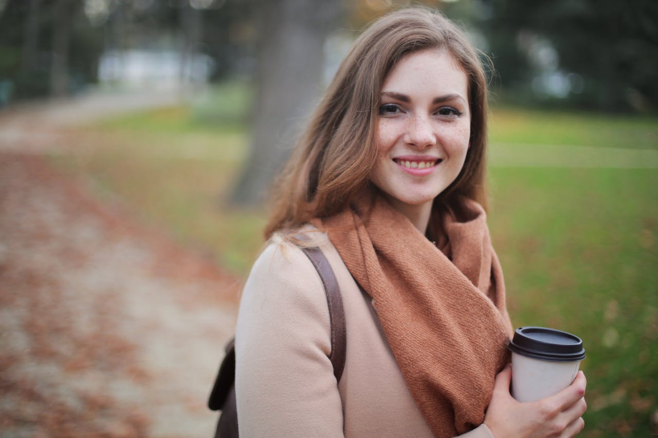 women smiling in a park
