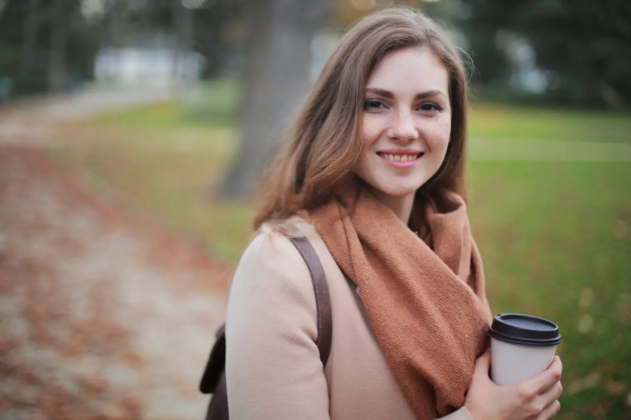 women smiling in a park